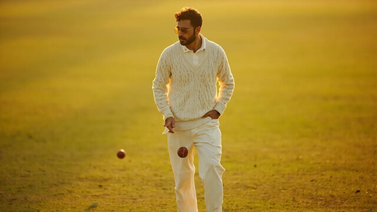 A captain addressing his team in a huddle during an afternoon T20
